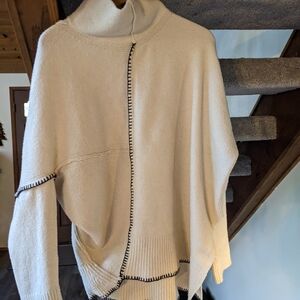 Chic Cream Turtleneck Sweater with Black Accents